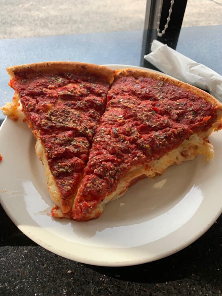 Deep dish slices from the Art of Pizza in Lakeview, Chicago. One of the best in the city and one of my favorite pizzas I've ever had.