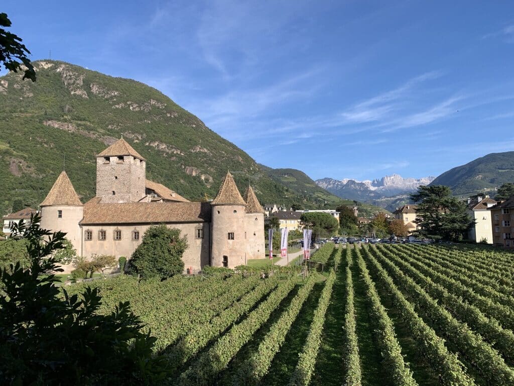 Castel Mareccio in Bolzano and the Dolomites in the background
