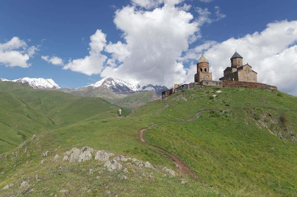 Gergeti Trinity Church in Georgia, which comes in at number seven on our list of the 15 most underrated countries.