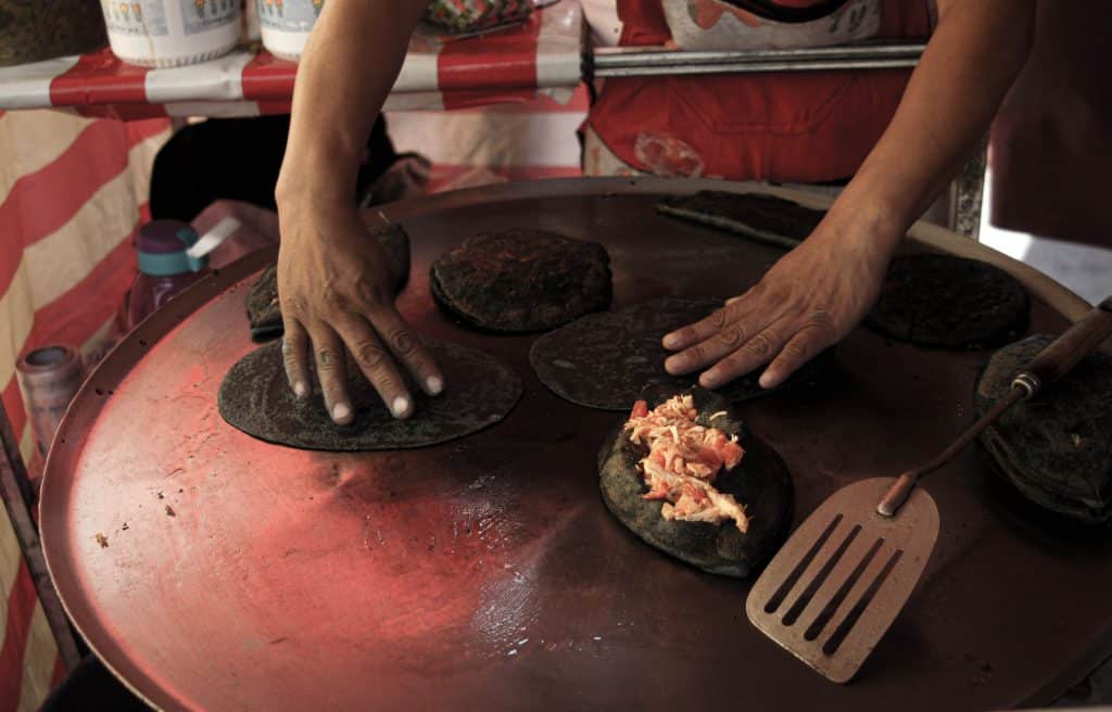 Cheap places to eat in Condesa: Street food stalls (puestos) like Quesadillas Doña Mari are a great option.